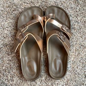 Sam Edelman rose gold Birkenstock sandals.